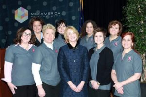 Pictured: (Front row, L to R) Jennifer Spicer, Diana Hahn, Ginny Tackett, Shelley Lakins, Lori Baxter. (Back row, L to R) Anita Walker, Susanna Bard, Suzy Paul, Nancy Riley.